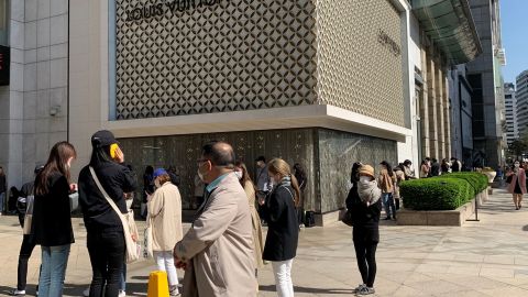 Shoppers lining up to enter a Louis Vuitton boutique in Seoul in May. "South Korea is almost mirroring what's happening in China," said Fflur Roberts, an analyst at Euromonitor.