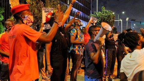 Demonstrators say the vigil was peaceful until the arrest of its organizer, Ernesto Yeboah.