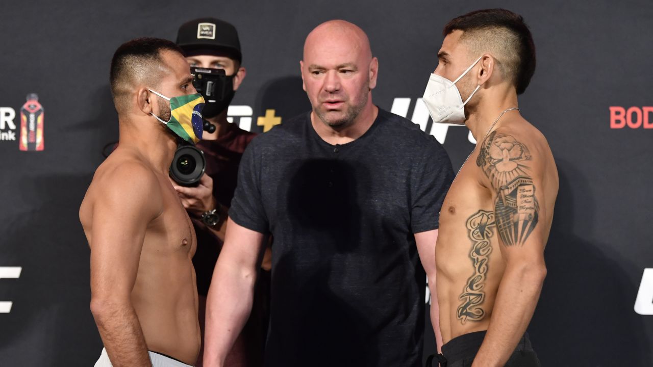 White hosts a face off between Jussier Formiga (left) and Alex Perez (right).