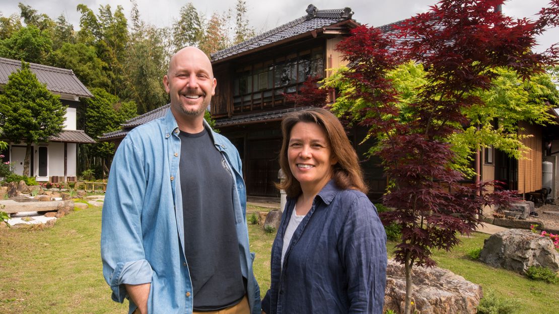 Paul and Kimberly Fradale in front of their traditional "kominka." 