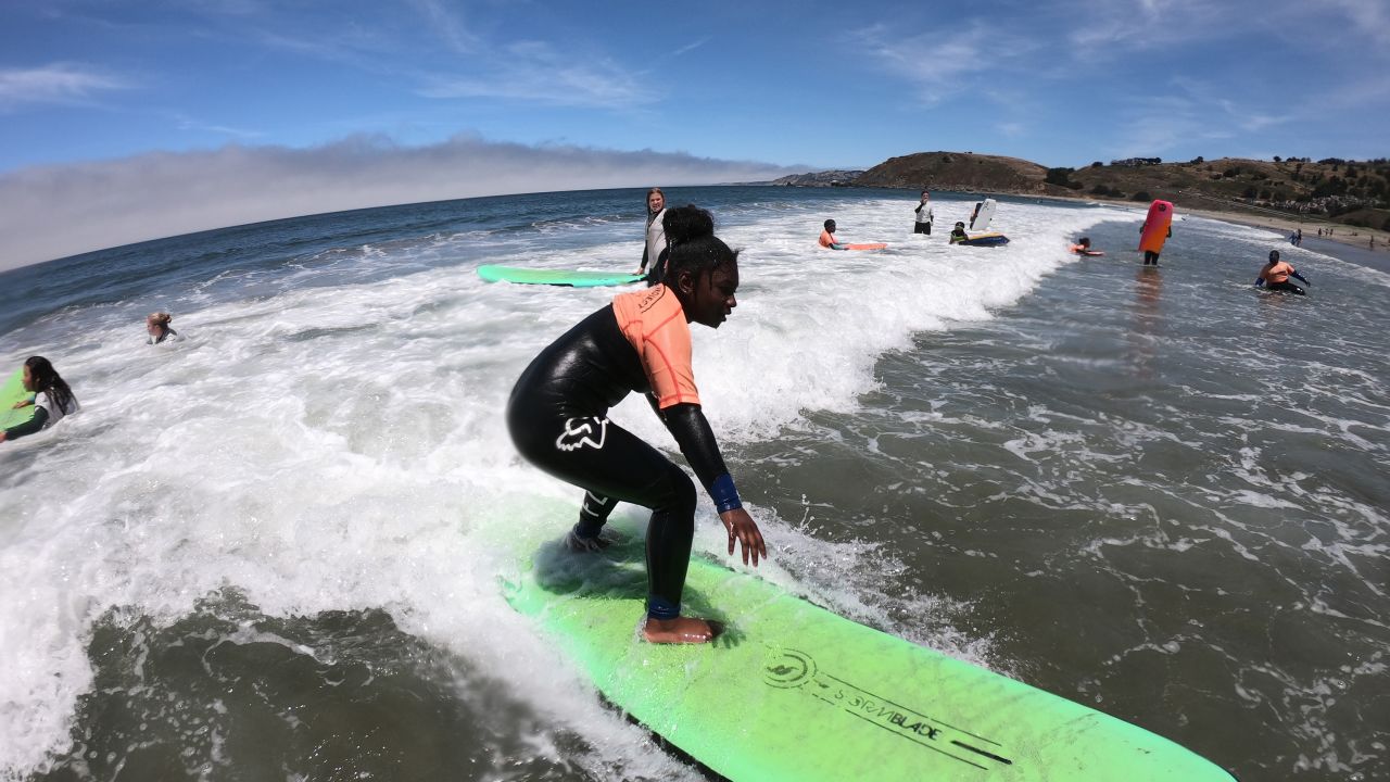 Children surfing with the City Surf Project summer camp in 2019.