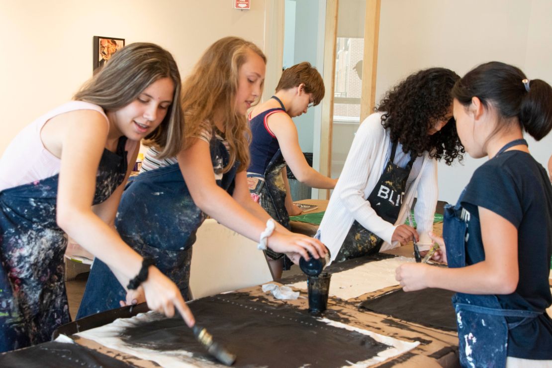 Children painting at Evanston Art Center's summer camp in 2019. 