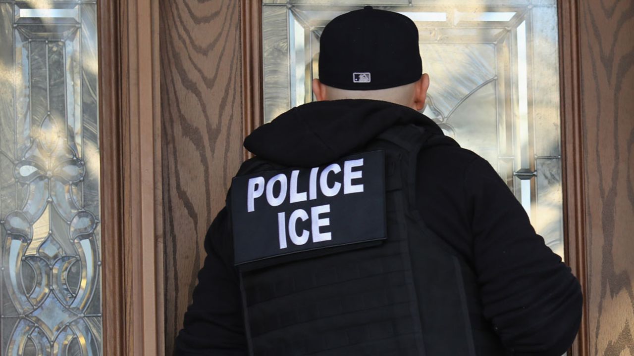 U.S. Immigration and Customs Enforcement officers arrive to a New York home in search of an undocumented immigrant in 2018.