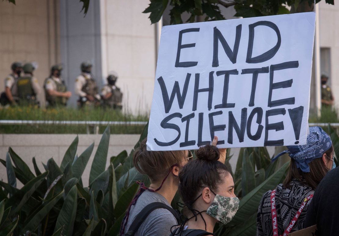 Supporters of Black Lives Matter hold signs during a protest in Los Angeles, California, on June 10, 2020. 