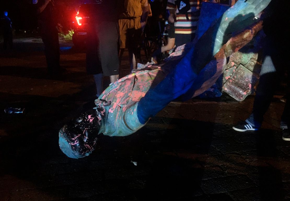 The statue of Confederate President Jefferson Davis is splattered with paint after it was toppled June 10 in Richmond.