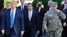 FILE - In this June 1, 2020 file photo, President Donald Trump departs the White House to visit outside St. John's Church, in Washington. Part of the church was set on fire during protests on Sunday night. Walking behind Trump from left are, Attorney General William Barr, Secretary of Defense Mark Esper and Gen. Mark Milley, chairman of the Joint Chiefs of Staff.  Milley says his presence "created a perception of the military involved in domestic politics." He called it "a mistake" that he has learned from.  (AP Photo/Patrick Semansky)