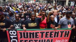 Pittsburgh residents protest a local police officer's fatal shooting of 17-year-old Antwon Rose Jr. at a Juneteenth parade in 2018. 