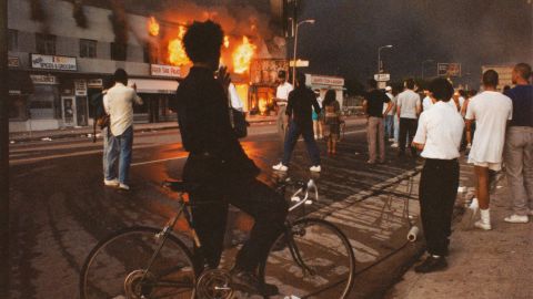 Businesses begin to burn on Pico Boulevard in Los Angeles during the Rodney King riots in 1992.