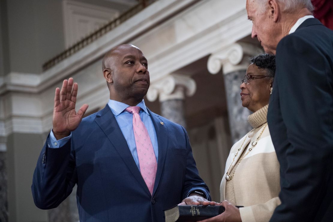 Sen. Tim Scott is administered an oath as his mother Frances looks on, by Vice President Joe Biden during a swearing-in ceremony in the Capitol's Old Senate Chamber on January 03, 2017. 