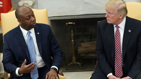 President Donald Trump listens to Sen. Tim Scott during a working session in the Oval Office of the White House in February 2018.