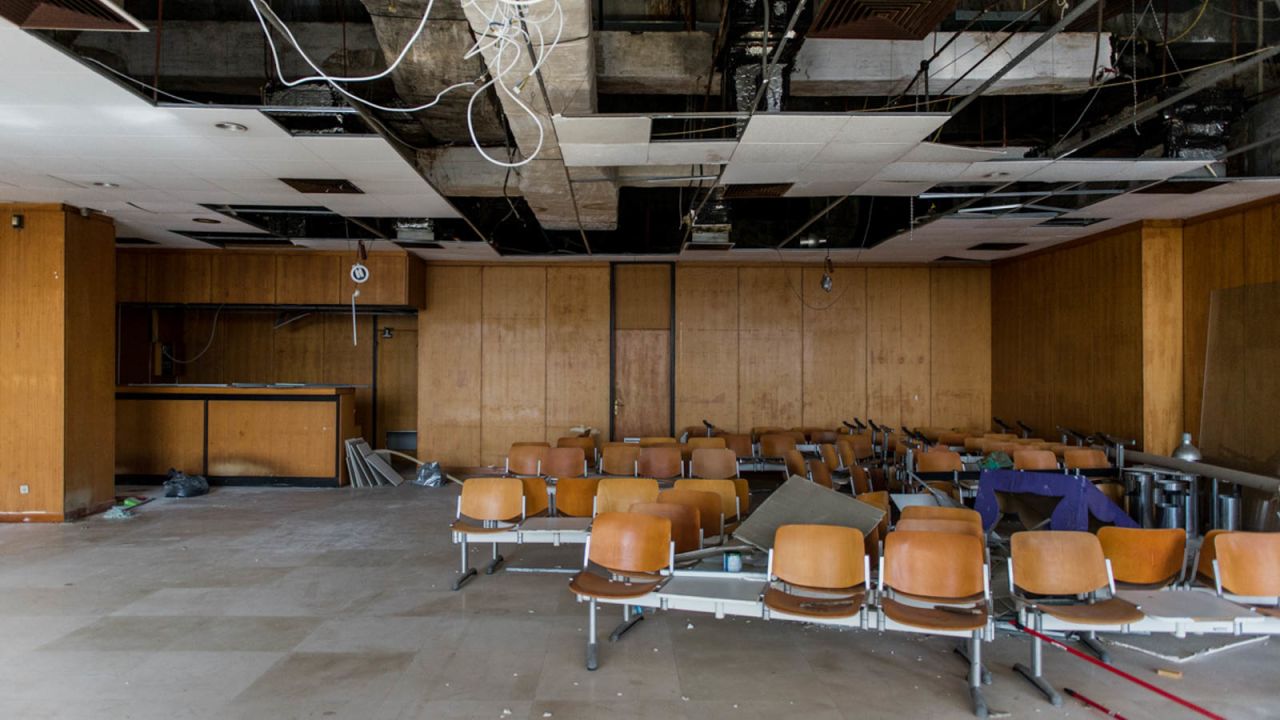 <strong>Frozen in time:</strong> Photos from 2020 show once-bustling airport lounges in a state of decay, with collapsing ceilings and half-ruined walls. 