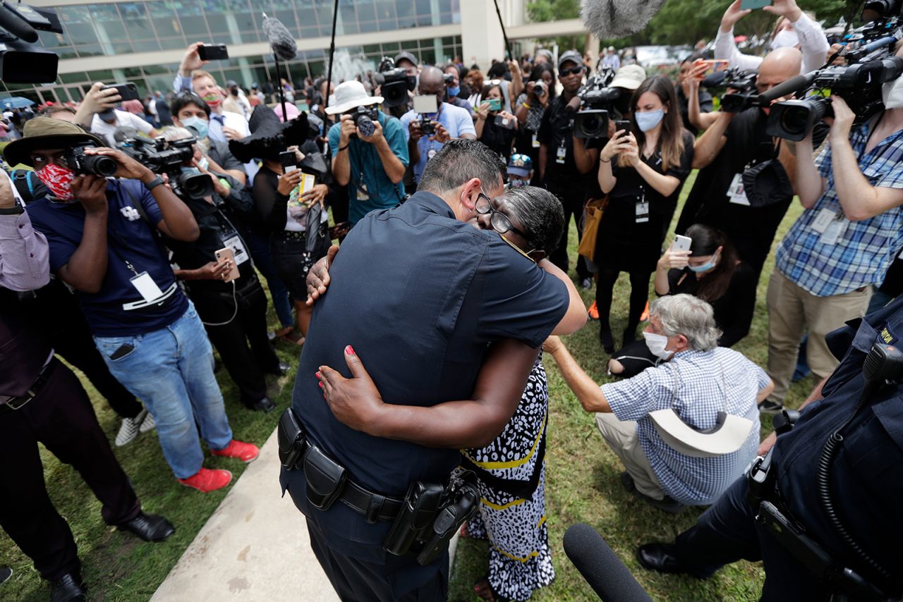 Houston Police Chief Art Acevedo hugs Charlene Davis after Davis prayed for him on Monday, June 8. She was among those standing in line for George Floyd's public visitation.
