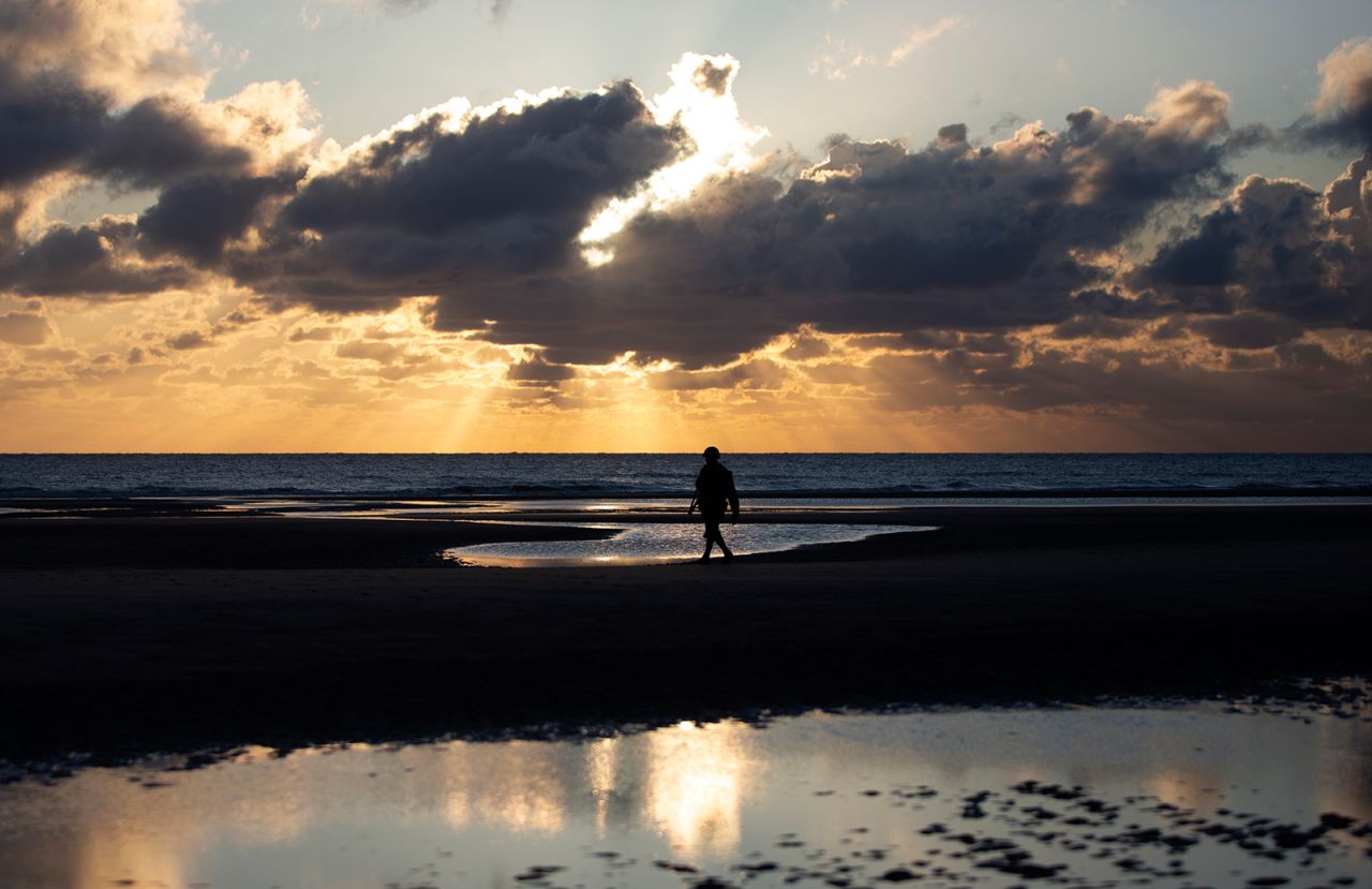 A man in a vintage World War II uniform walks at sunrise prior to a D-Day ceremony in Normandy, France, on Saturday, June 6. This year marked the 76th anniversary of <a href="https://www.cnn.com/2019/05/27/world/gallery/d-day-normandy-invasion/index.html" target="_blank">D-Day,</a> which proved to be a turning point in World War II. <a href="http://www.cnn.com/2020/06/04/world/gallery/week-in-photos-0605/index.html" target="_blank">See last week in 40 photos</a>