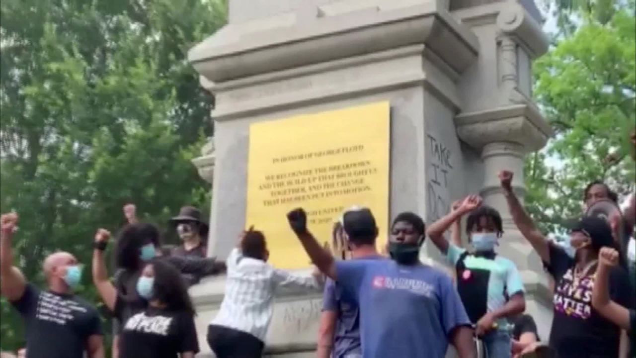 Protesters in Raleigh replace the inscription on a confederate monument with a memorial For George Floyd.