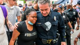 DENVER, CO - JUNE 01: Denver Police Chief Paul Pazen embraces a woman during a march to protest the death of George Floyd on June 1, 2020 in Denver, Colorado. Protests continue in cities across the country after Floyd, a black man, died in police custody in Minneapolis on May 25. (Photo by Michael Ciaglo/Getty Images)
