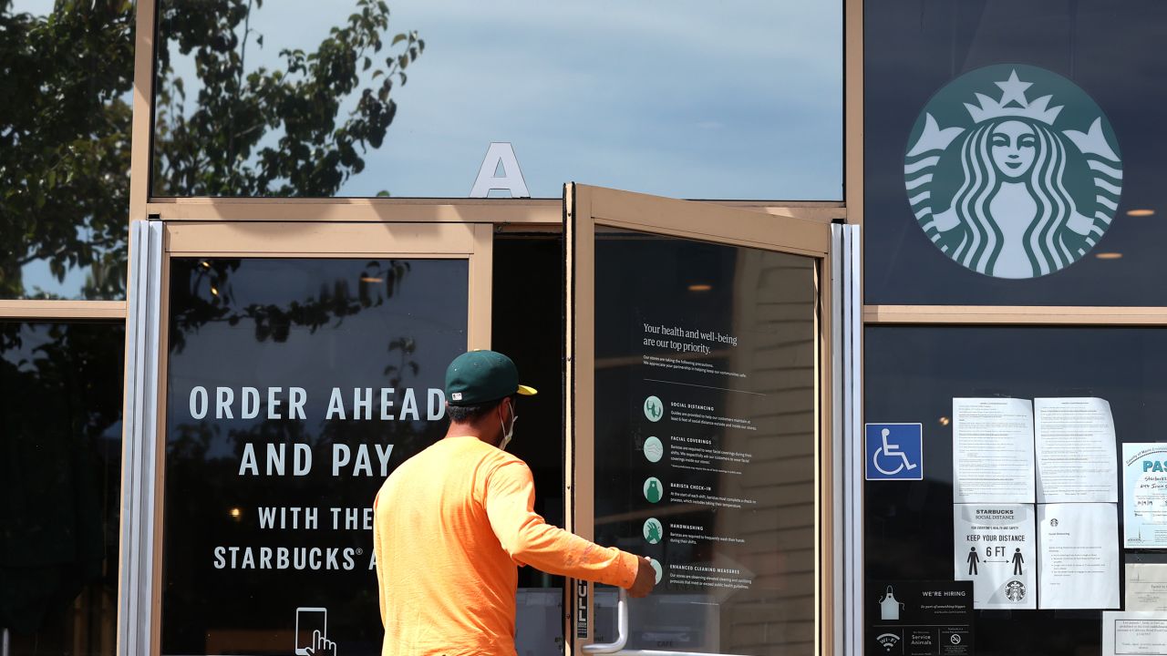 SAN RAFAEL, CALIFORNIA - JUNE 10: A customer enters a Starbucks Coffee store on June 10, 2020 in San Rafael, California. Starbucks announced plans to close 400 of its company owned cafes over the next 18 months as the coffee shop chain estimates losing over $3 billion due to the coronavirus COVID-19 pandemic. (Photo by Justin Sullivan/Getty Images)