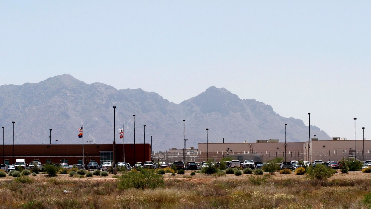 Vehicles are parked outside the La Palma Correctional Center in Eloy, Arizona, May 2010. 