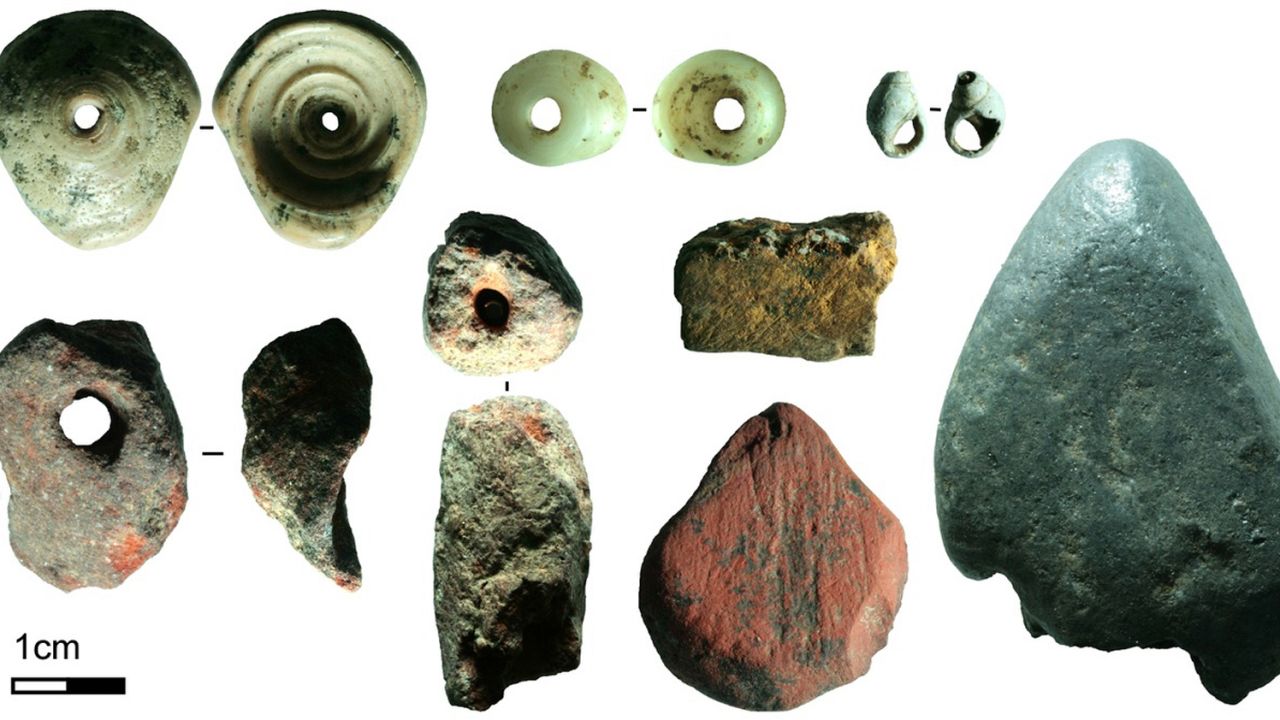 The shell beads, as well as different pigments in bright red, yellow, and silver, were used for personal ornamentation.