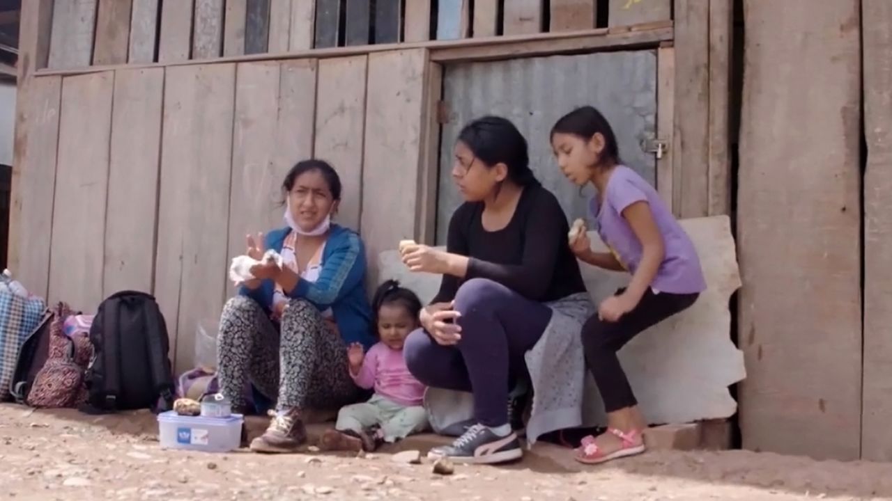 Maria Tambo, left, takes a break with her children, Melec, Amelie and Yacira.