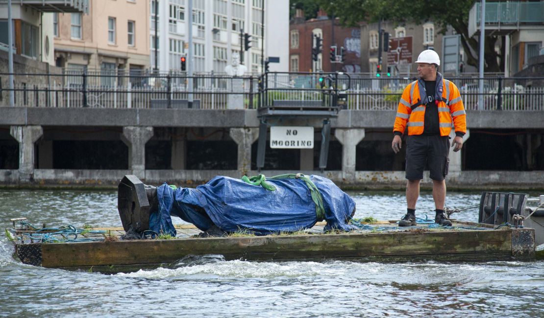The statue of Edward Colston is recovered from the harbour in Bristol, England, on Thursday, June 11, after it was toppled by anti-racism protesters last weekend.
