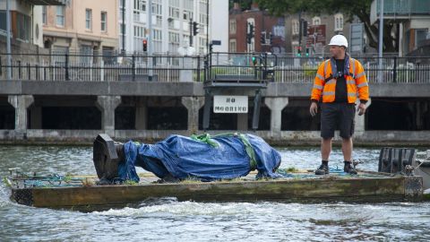 In this photograph made available by Bristol City Council, the statue of Edward Colston is recovered from the harbour in Bristol, Thursday June 11, 2020, after it was toppled by anti-racism protesters.