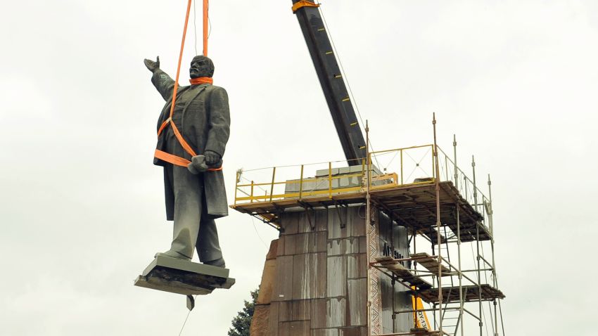 Workers dismantle a huge Lenin's monument in city of Zaporizhia, Ukraine on March 17, 2016. 
It took two days and a giant crane, but Ukraine on March 17 finally managed to lift its biggest remaining statue of Soviet founder Lenin off its pedestal and consign it to the dustbins of history. The 20-meter-tall (65-foot-tall) bronze and granite monument fell victim to a Ukrainian ban on Soviet symbols that was imposed in May 2015 as part of the Russian neighbour's drive toward closer relations with the European Union.  / AFP / PRYLEPA LEKSANDER        (Photo credit should read PRYLEPA LEKSANDER/AFP via Getty Images)