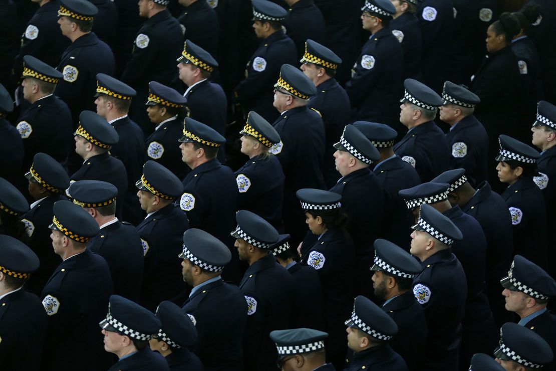 Officers attend the funeral Mass in 2018 of Chicago police Cmdr. Paul Bauer.