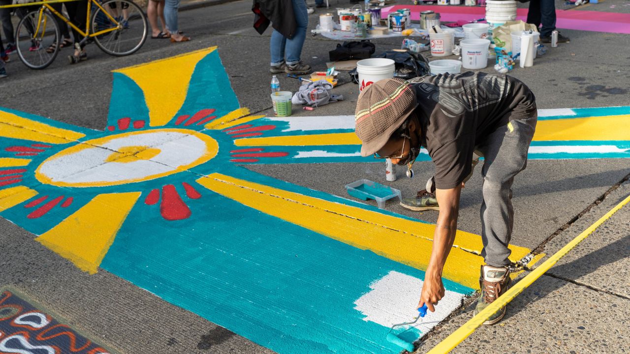 Local artists each took a letter of Black Lives Matter to creat a street mural.