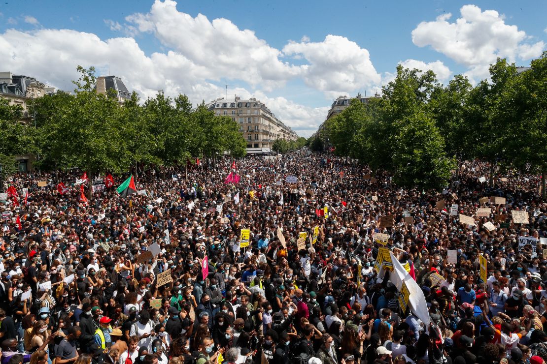 Thousands of people demonstrate against police brutality and racism in Paris on Saturday, before a march organized by supporters of Adama Traore, who died in the custody of French police in 2016.