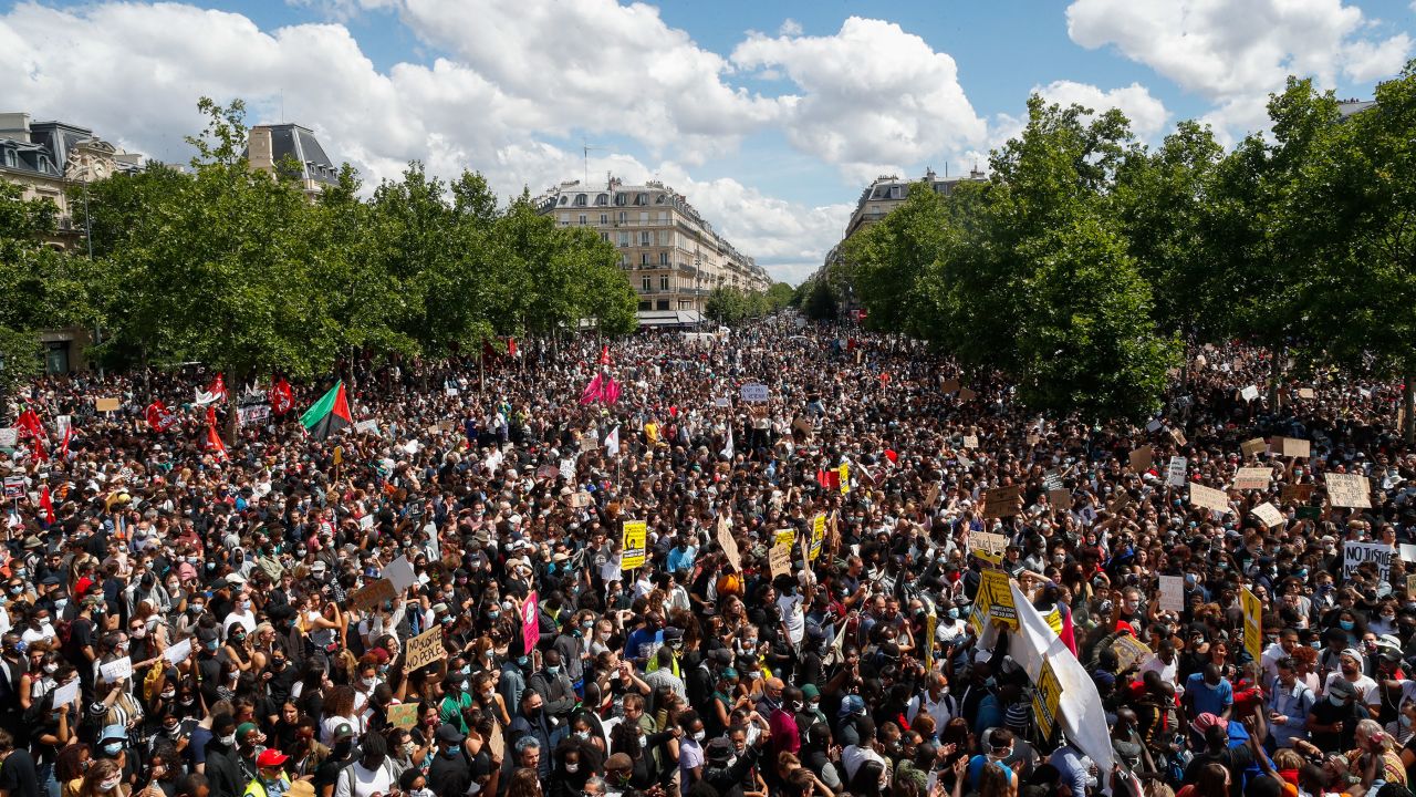 Thousands of people demonstrate against police brutality and racism in Paris on Saturday, before a march organized by supporters of Adama Traore, who died in the custody of French police in 2016.