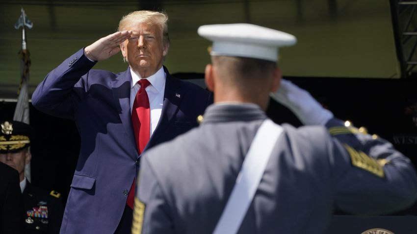 US President Donald Trump salutes as he arrives at the 2020 US Military Academy  graduation ceremony in West Point, New York, June 13, 2020. - Trump is delivering the commencement address at the 2020 US Military Academy Graduation Ceremony. The Military Academy will graduate more than 1,000 cadets at the in-person ceremony, with social distancing in place to preventing the transmission of the coronavirus.