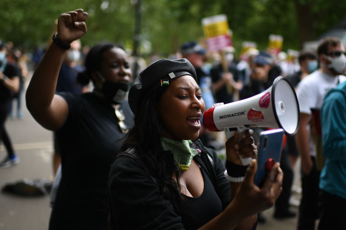 A woman addresses protesters gathered in support of the Black Lives Matter movement in Hyde Park, central London on Saturday.