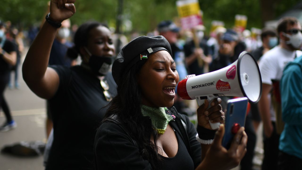 A woman addresses protesters gathered in support of the Black Lives Matter movement in Hyde Park, central London on Saturday.