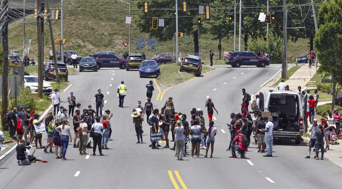 Protestors block University Avenue near the Wendy's restaurant in Atlanta on Saturday, June 13, 2020, where Rayshard Brooks, a 27-year-old black man, was shot and killed by Atlanta police Friday evening during a struggle in the restaurant's parking lot.