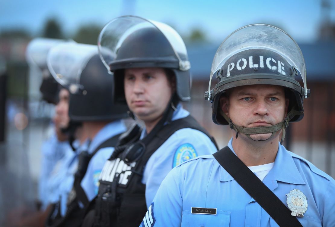 Police are deployed to keep peace along Florissant Avenue in Ferguson, Missouri, in August 2014, a week after Michael Brown was shot and killed in the neighborhood, sparking violent protests.