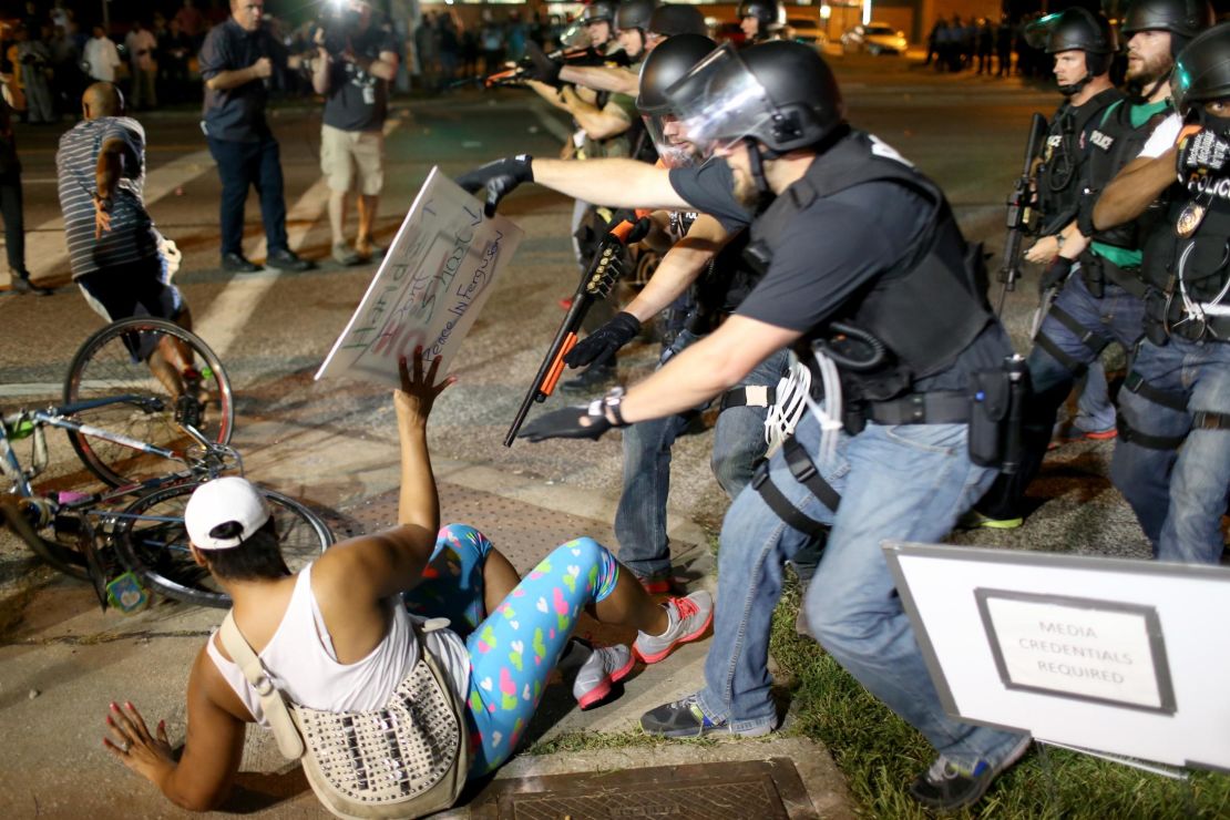 Police officers arrest a demonstrator in Ferguson, Missouri, during protests following the death of Michael Brown in August 2014. 