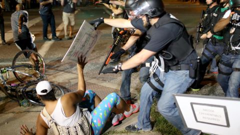 Police officers arrest a demonstrator in Ferguson, Missouri, during protests following the death of Michael Brown in August 2014. 