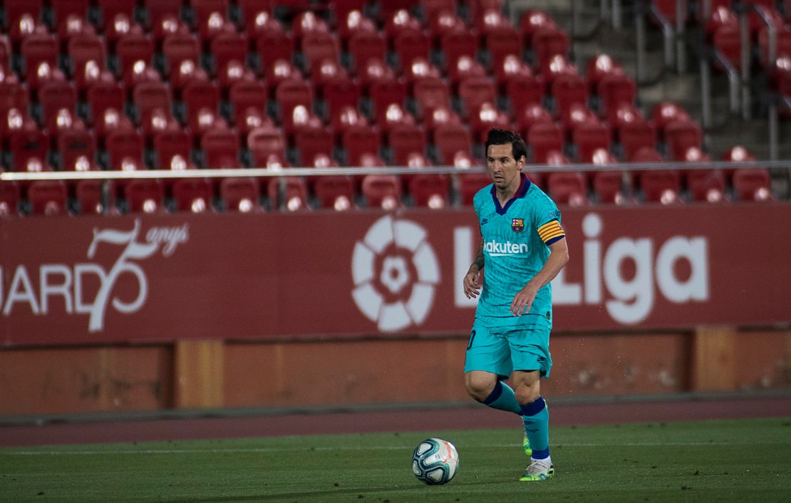 Lionel Messi dribbles during Barcelona's game at Mallorca on Saturday behind closed doors. 