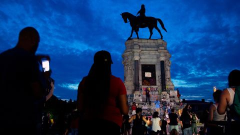 People gather around a Robert E. Lee statue in Richmond, Virginia, this month.