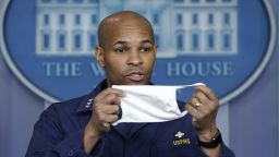 WASHINGTON, DC - APRIL 22: U.S. Surgeon General Jerome Adams holds up his face mask during the daily briefing of the coronavirus task force at the White House on April 22, 2020 in Washington, DC. Dr. Redfield, has said that a potential second wave of coronavirus later this year could flare up again and coincide with flu season. (Photo by Drew Angerer/Getty Images)