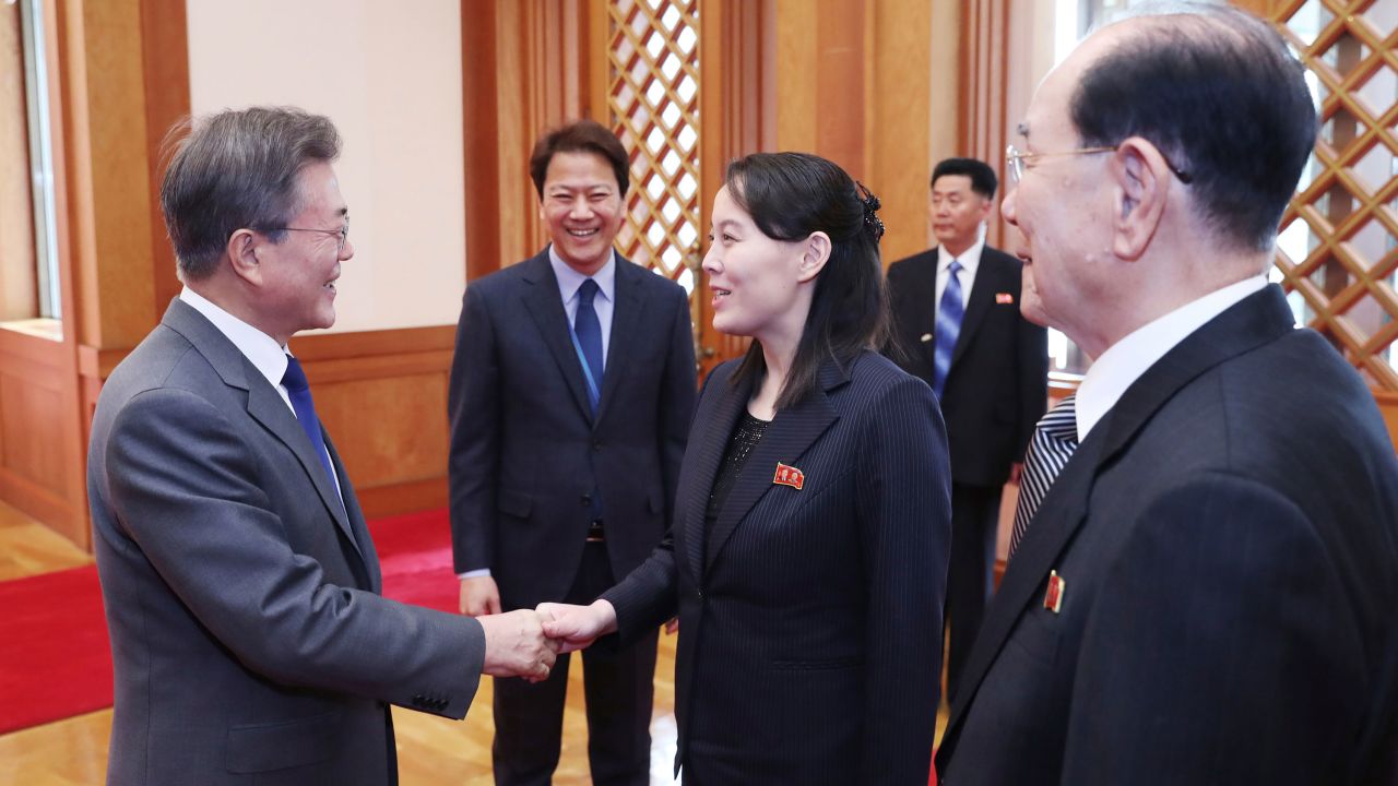 South Korean President Moon Jae-in, left, shakes hands with Kim Yo Jong, North Korea leader Kim Jong Un's sister.