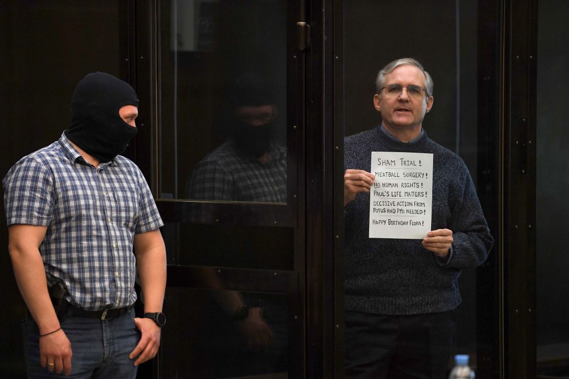 Whelan held up a sign as his sentence was delivered reading "Sham trial," "No human rights" and "Paul's life matters."