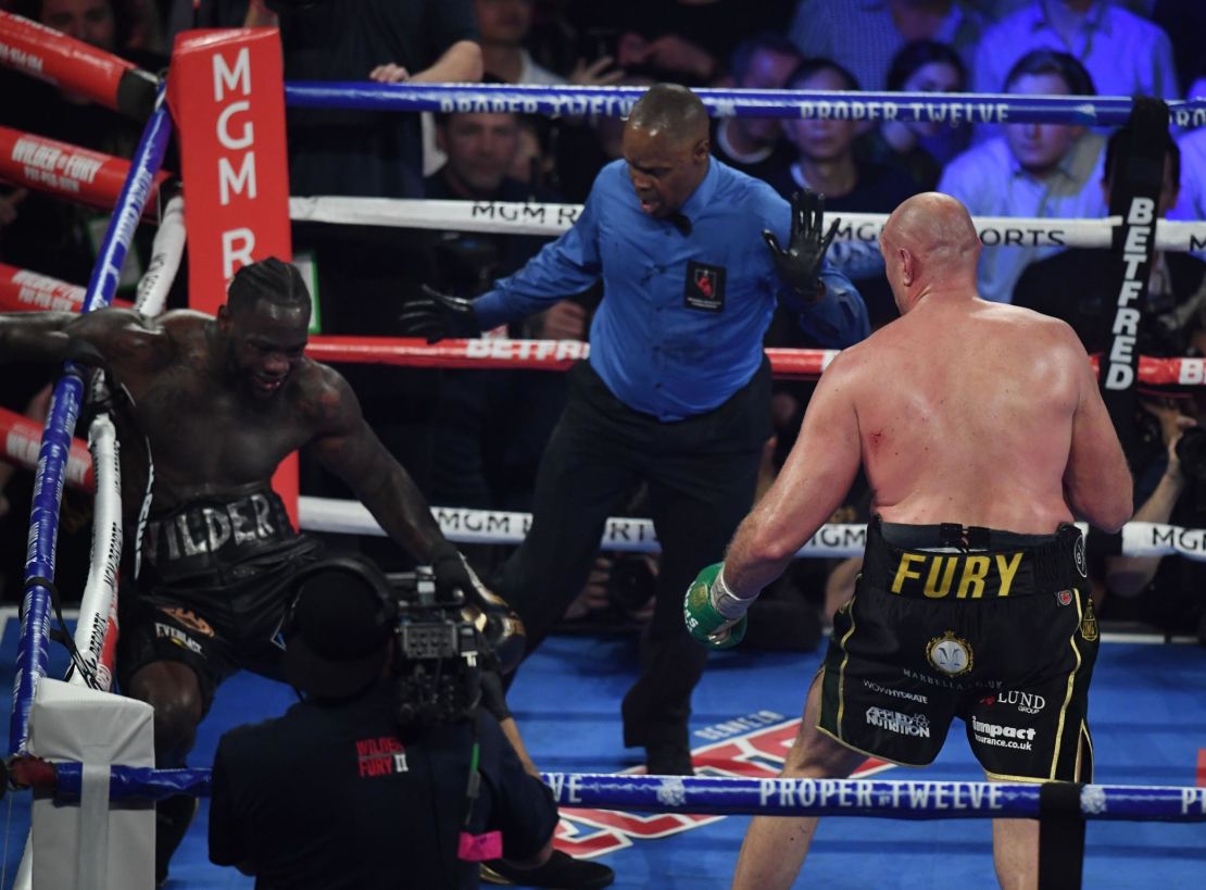 Fury knocks US boxer Deontay Wilder down before defeating him.
