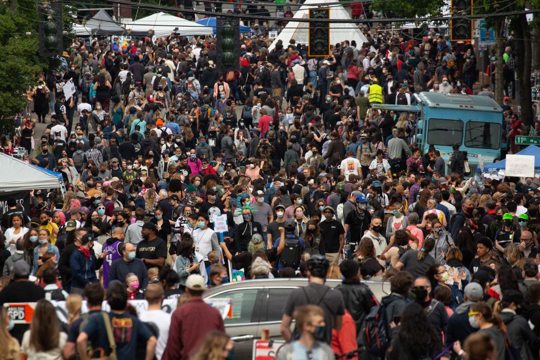 Large crowds flocked to Seattle's Capitol Hill neighborhood over the weekend as demonstrators remained in an area they have designated CHAZ or CHOP.