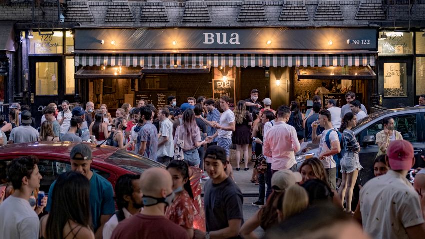 People drink outside a bar during the reopening phase following the coronavirus disease (COVID-19) outbreak in the East Village neighborhood in New York City, U.S., June 12, 2020. Picture taken June 12, 2020. REUTERS/Jeenah Moon     TPX IMAGES OF THE DAY
