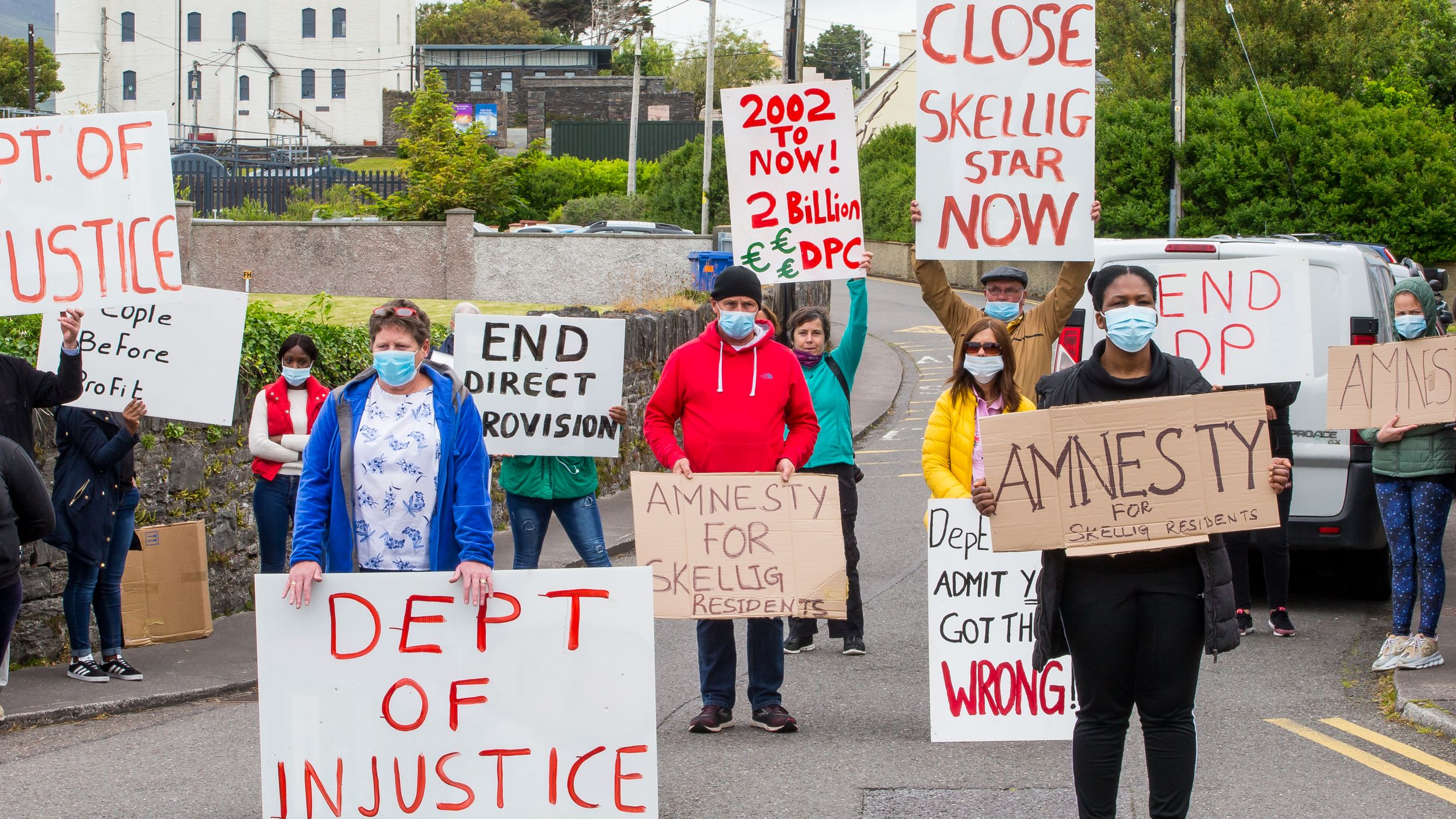 Cahersiveen locals and residents of the Skellig Star accomodation center call for the resignation of Justice Minister Charlie Flanagan on Tuesday, June 9, in Cahersiveen, Ireland. (Photo: Alan Landers)