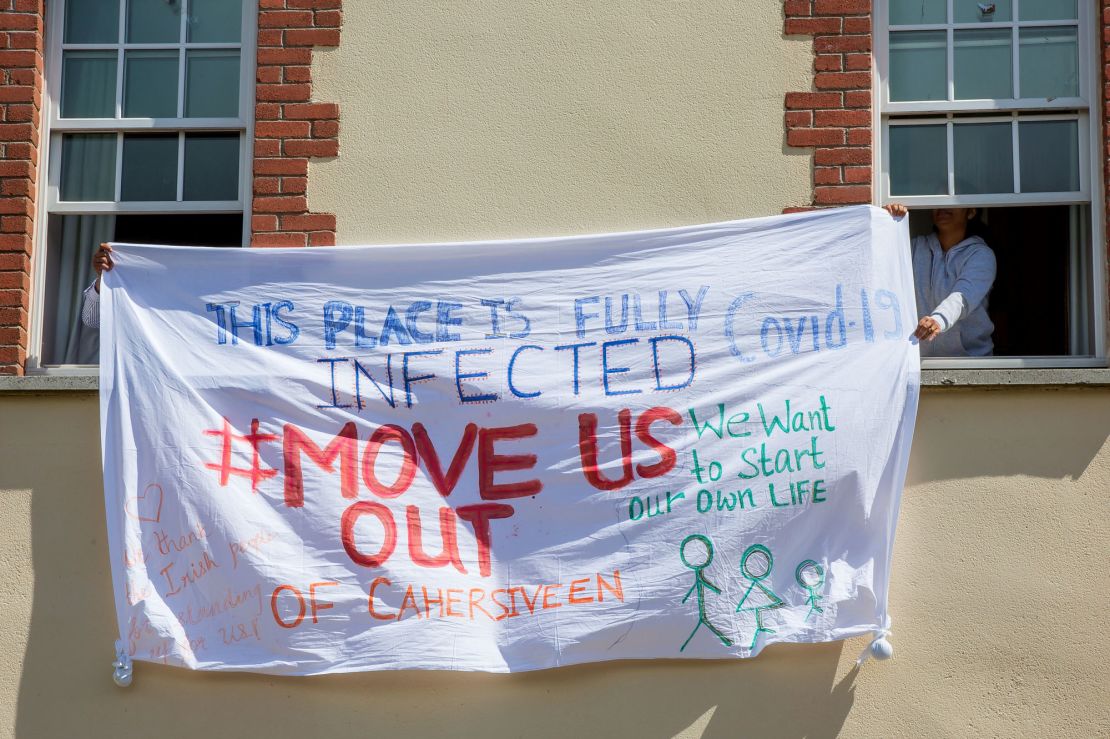 Asylum seekers at the Skellig Star hold a banner protesting the handling of the Covid-19 outbreak on May 7.