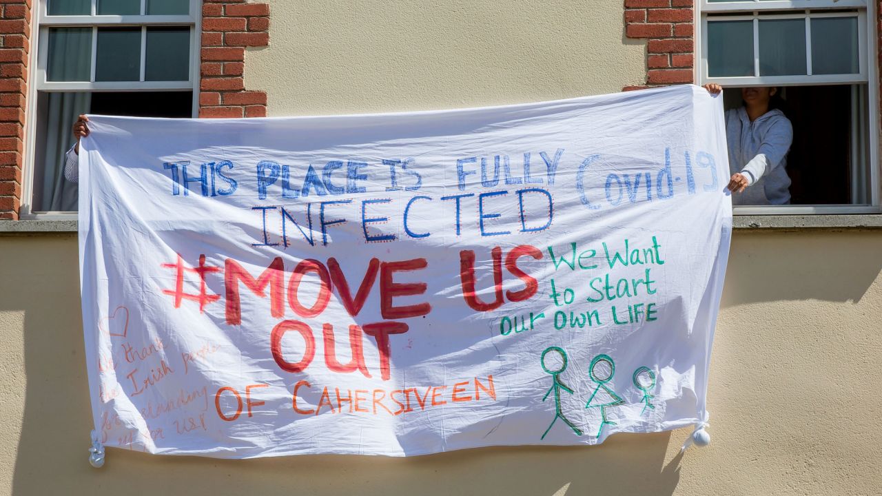 Asylum seekers at the Skellig Star hold a banner protesting the handling of the Covid-19 outbreak on May 7.