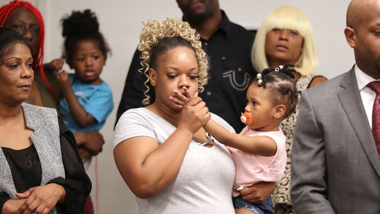 Tomika Miller, the wife of Rayshard Brooks, holds their daughter Memory, 2, during the family press conference on Monday, June 15, 2020, in Atlanta. Brooks was killed by an APD officer Friday.