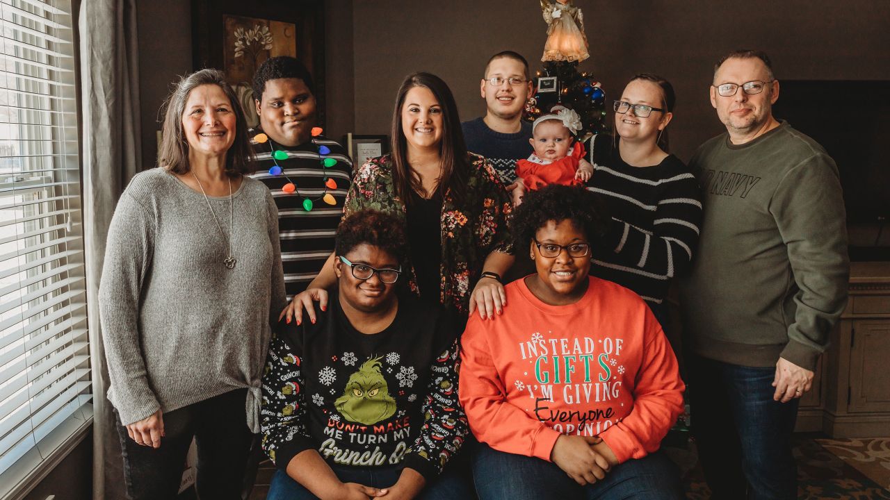 The Guest family poses for a family photo. Front row from left: Ajene Guest and Abby Guest; second row from left: Dawn Guest, Andre Guest, Jessica Plunkitt, Zachary Guest, Elizabeth Guest, Laura Guest, Johnny Guest. (Courtesy of Amber Springer/Wildflower Photography)